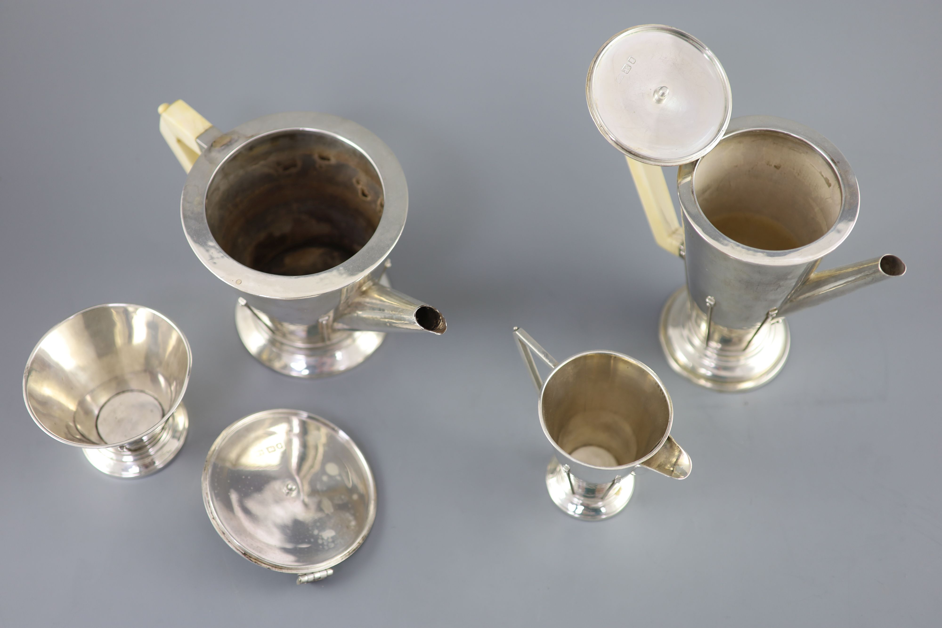 A stylish 1930s Art Deco silver four piece tea and coffee service by Charles Boyton,